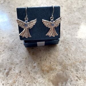 Angel earrings with blue stones. New. Pierced ear wires.